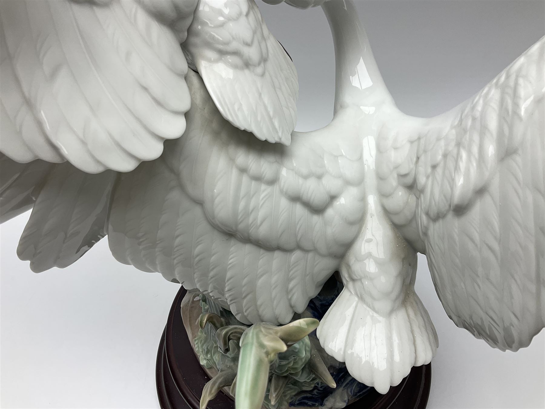 Large Lladro figure group, Swans Take Flight, modelled as two swans upon raised on circular wooden plinth, sculpted by Salvador Debon, H68cm