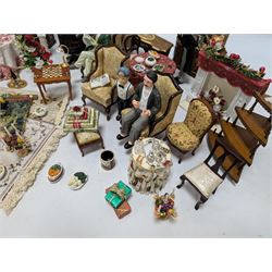 Dolls house living room and dining room furniture, including arm chairs, desk, fireplaces, dressers, tables, eight figures and a large collection of predominantly Christmas themed food, accessories and decorations