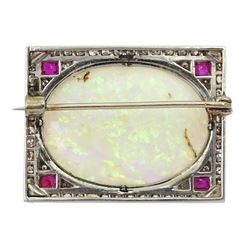 Art Deco platinum opal, diamond and ruby brooch, the cabochon oval opal surrounded by pave set diamonds and four rubies at each corner

Notes: By direct decent from Barraclough family