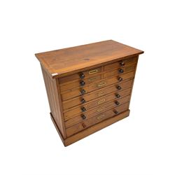 Late 19th century pitch pine multi-drawer chest or collectors cabinet, fitted with nine slides, on plinth base