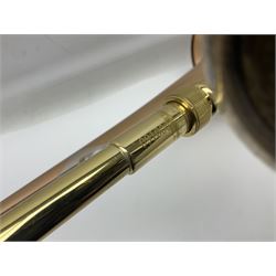 Sebastian Bucklet Aquae Sulis copper and brass trombone No.0910004; in lightweight carrying case; and Kinsman folding tubular chrome music stand in case (2)