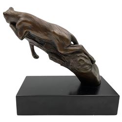 Bronze modelled as a cougar on a branch upon a rectangular wooden plinth, H24cm