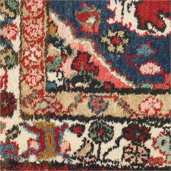 Small Persian crimson ground Hamadan rug, decorated with central medallion surrounded by stylised foliate motifs with repeating guard lines
