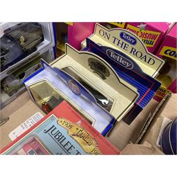 Collection of Tetley Tea collectibles to include sixteen 1:43 scale model cars from Lledo and Oxford Die-Cast with further Tetley Tea figures and tinned coaster set
