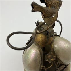 Victorian evening dinner bell, with three mother of pearl shells, floral and grape gilt decoration, and bird finial, raised upon a circular soapstone base with gilt pierced gallery, H14cm