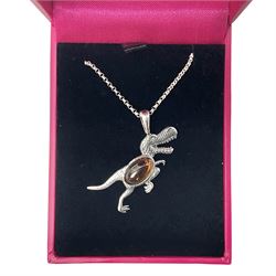 Silver Baltic amber dinosaur pendant necklace, stamped 925 