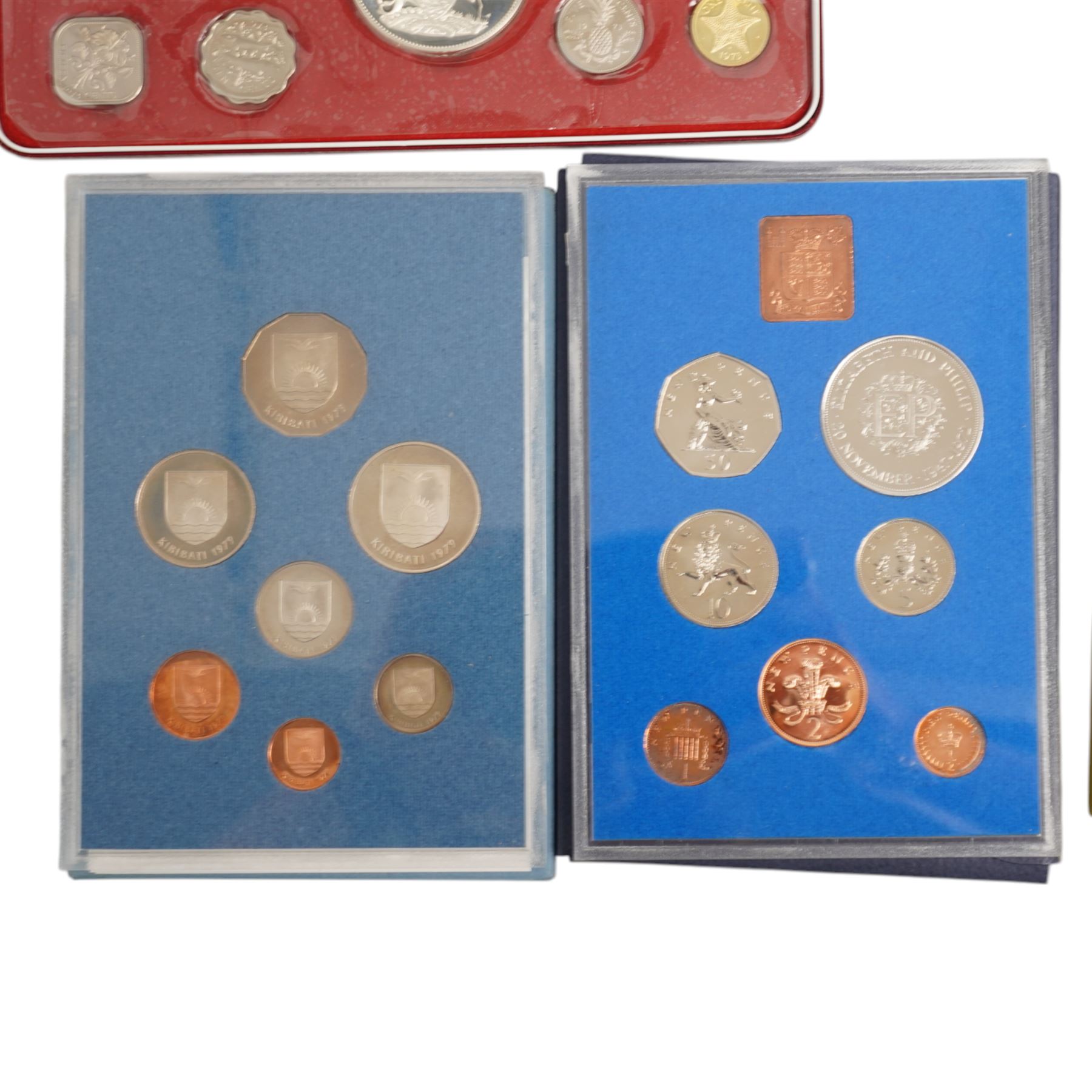 Twelve international proof coin sets, all produced by The Franklin Mint and containing high denomination silver coins, comprising two Republic of the Philippines 1975 proof eight coin sets, two Commonwealth of the Bahamas proof nine coin sets, 1973 and 1976, Guyana 1976 proof eight coin set, Jamaica 1976 proof nine coin set, Papua New Guinea 1976 proof eight coin set, First National Coinage of Barbados 1973 proof eight coin set, Ethiopia 1977 proof five coin set, Republic of Seychelles 1976 proof eight coin set, British Virgin Islands 1977 Royal Silver Jubilee proof six coin set, First Official Coinage of the British Virgin Islands 1973 proof six coin set; together with Pobjoy Mint Isle of Man 1977 silver proof seven coin set, 'Commemoration of the 1100th Anniversary of the Settlement of Iceland' 1974 proof two coin set, The Royal Mint United Kingdom 1977 Silver Jubilee silver proof crown coin, and other international proof sets