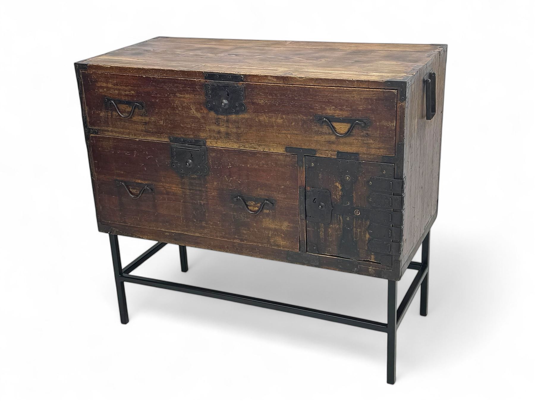Late 19th century Japanese tansu chest, crafted with a cedar frame and cypress wood panels, original iron fittings throughout, comprising a single long drawer above smaller drawer and hinged cupboard door enclosing two smaller internal drawers and storage compartment, mounted on a bespoke black metal stand