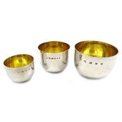 Set of three silver tumbler cups with gilt interiors by J A Campbell London 2001, diameter 7.5cm dim. approx 9oz