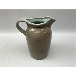 Studio pottery jug with applied decoration in the form of a bird on a brown ground H24cm