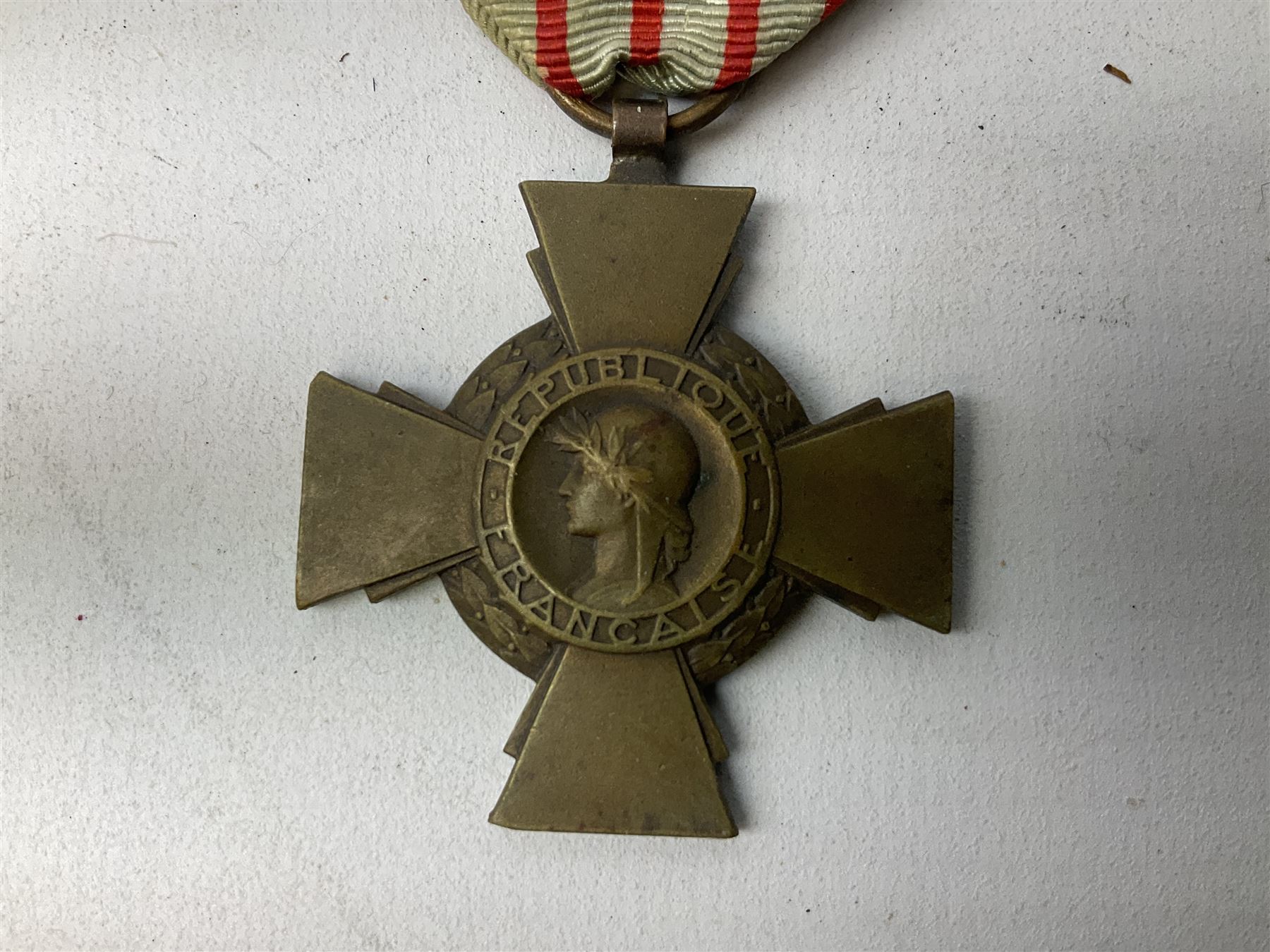 Five continental medals - WW1 Belgian Cross of Fire; WW1 French Croix De Guerre; French Croix De Combattant; French Republic Workers silver merit awarded to L. Mounet 1950; and boxed French Palmes Universitaires Officier d'Academie silver and enamel wreath (5)