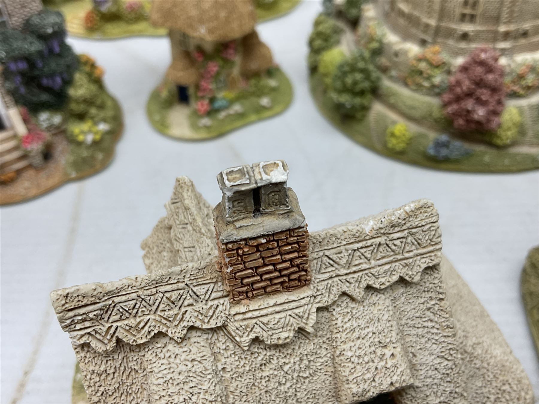 Sixteen Lilliput Lanes, to include The Golden Jubilee, Round Tower - Windsor Castle, Castle of the Golden Chalice, Travellers Rest, with box and deed,  Summer Days, Sunshine Creek, Writing with Lewis Carol, with box and deed,  etc 