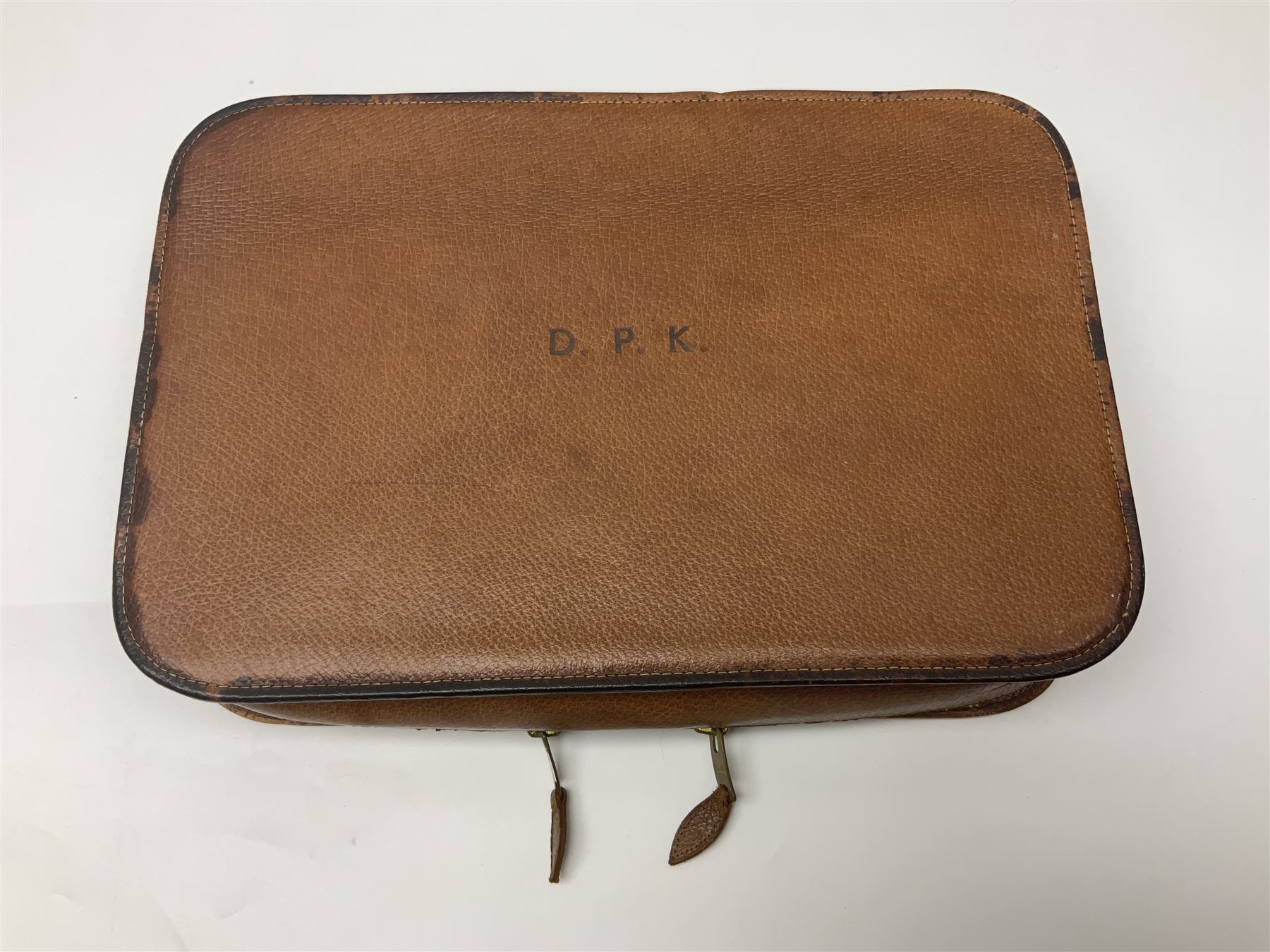 Mappin & Webb leather cased campaign gentleman's vanity set, the tan leather case opening to reveal fitted interior with five engine turned silver capped glass vanity bottles, hallmarked Mappin & Webb, London 1944, brushes, mirror etc, monogram DPK to the top of the case