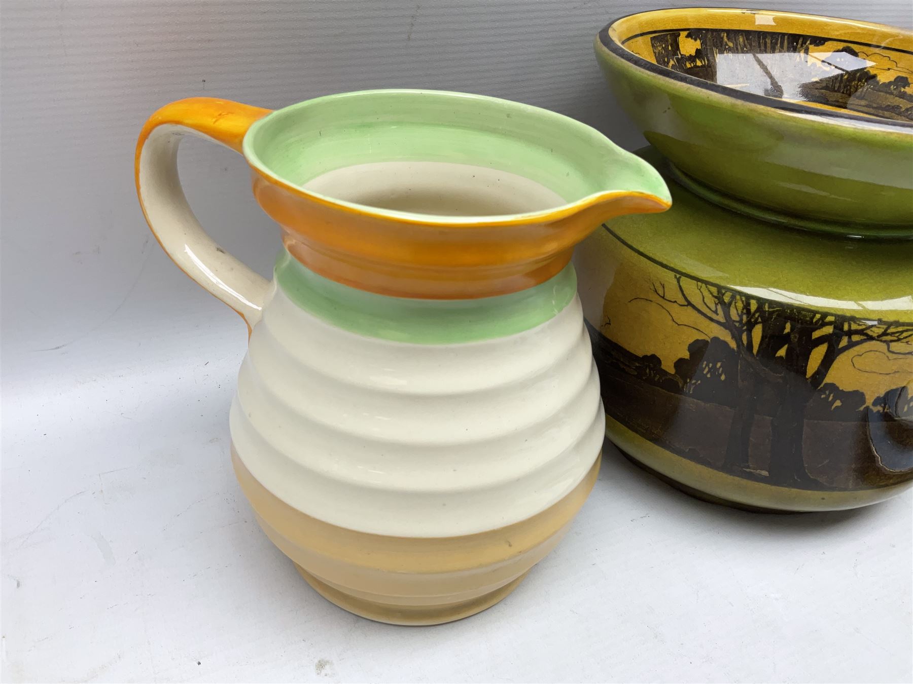 Royal Doulton wide rimmed jardinière, together with two Royal Doulton jugs, Arthur Wood jugs etc