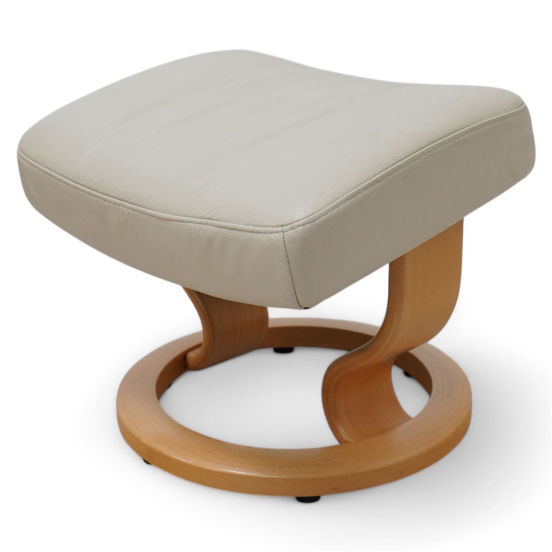 Ekornes - Stressless chair with stool, with padded arms and high backrest, raised on a circular mahogany-stained swivel base, fitted with reclining tension adjustment handle, supplied with stool with a lighter wood base 