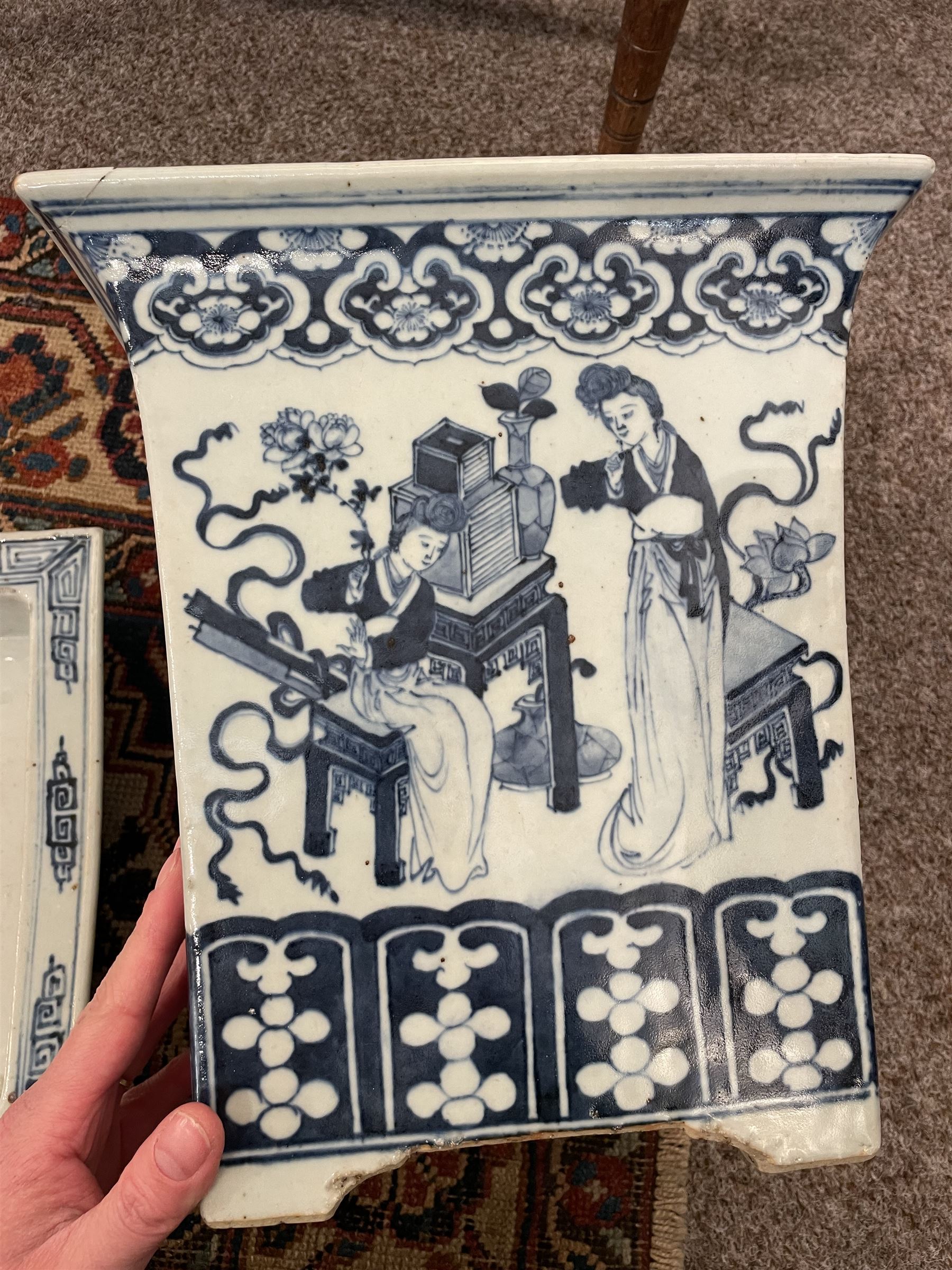 19th century Chinese blue and white planter and stand, each of square slightly tapering and flared form, the planter decorated with figures and precious objects between stylised foliate borders, the stand decorated with landscapes beneath a lipped rim with cell band, planter H28cm D25.5cm, stand H7cm D26cm
