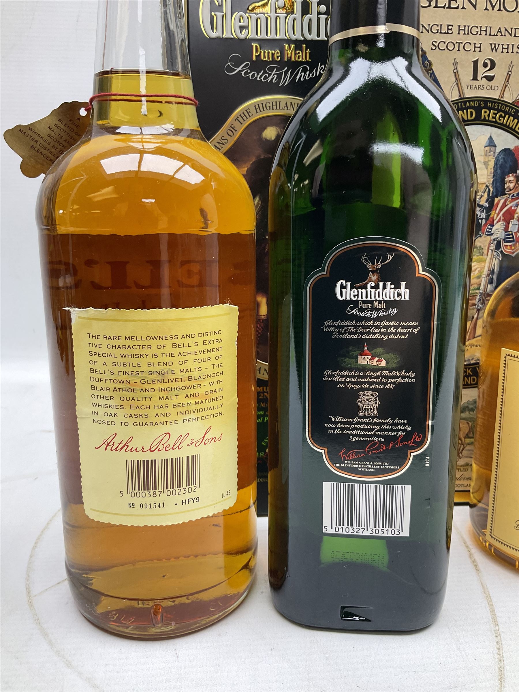 Glen Moray 12 Year Single Malt Highland Scotch Whisky, 70cl 40% vol, one bottle, in Highland Regiments The Black Watch presentation tin, Glenfiddich Pure Malt Scotch Whisky, Special Old Reserve, 70cl 40% vol, one bottle, in Clan Murray presentation tin, Bell's Extra Special Old Scotch Whisky, Aged 8 Years, 70cl 40% vol, one bottle, in box and Bell's Extra Special Old Scotch Whisky, 1l, 43% vol (4)