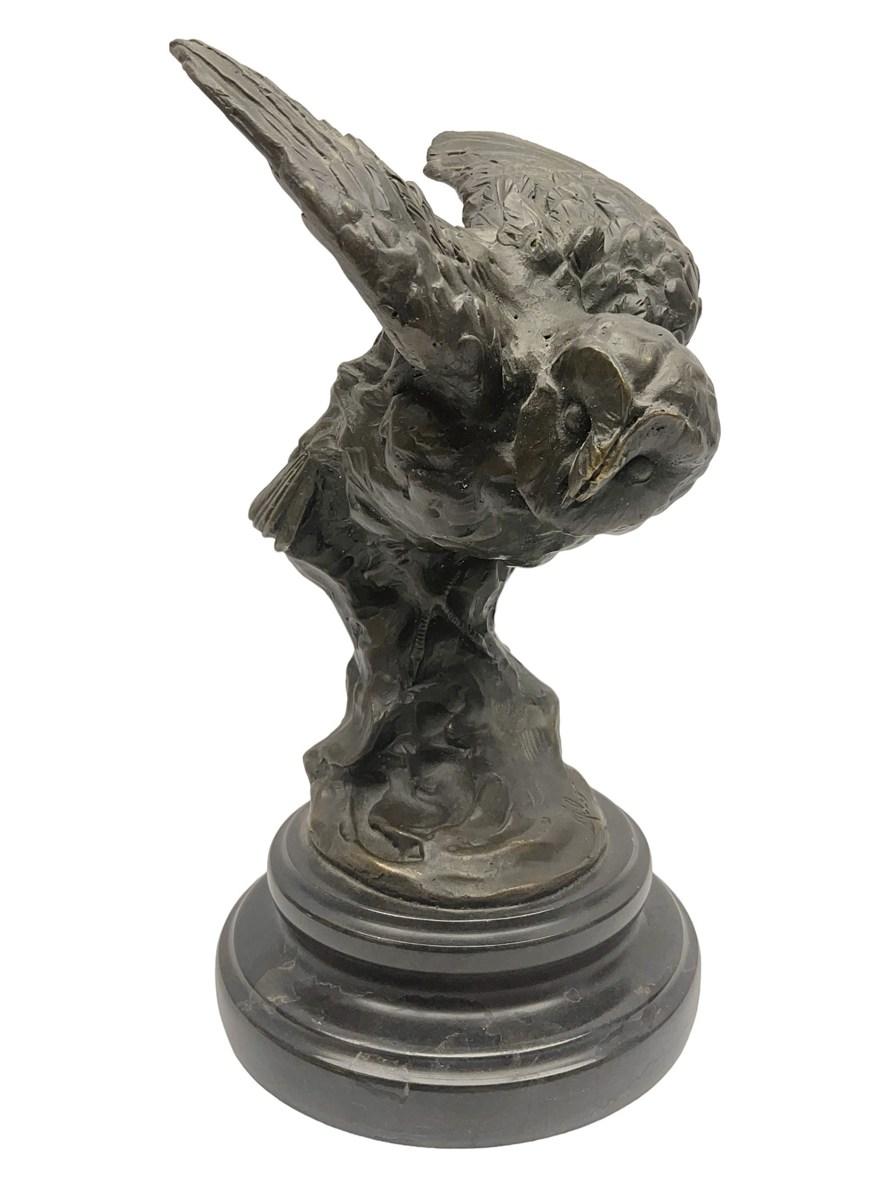 Bronze figure, modelled as an owl upon a rock, on stepped circular base, after Milo, H24.5cm