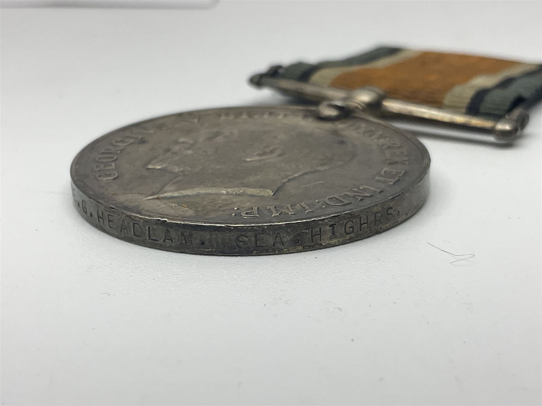 WW1 pair of medals comprising British war medal and Victory Medal awarded to 19774 Pte. G. Headlam Sea. Highrs.; another WW1 pair of medals comprising British War Medal and Mercantile Marine Medal awarded to Charles Filburn; WW2 group of five medals comprising 1939-45 War Medal, Defence Medal, 1939-45 Star, Africa Star and Burma Star; in issue box addressed to Mr. H, Smithson with medal slip; all with ribbons; and Edward VIII Coronation medal (10)