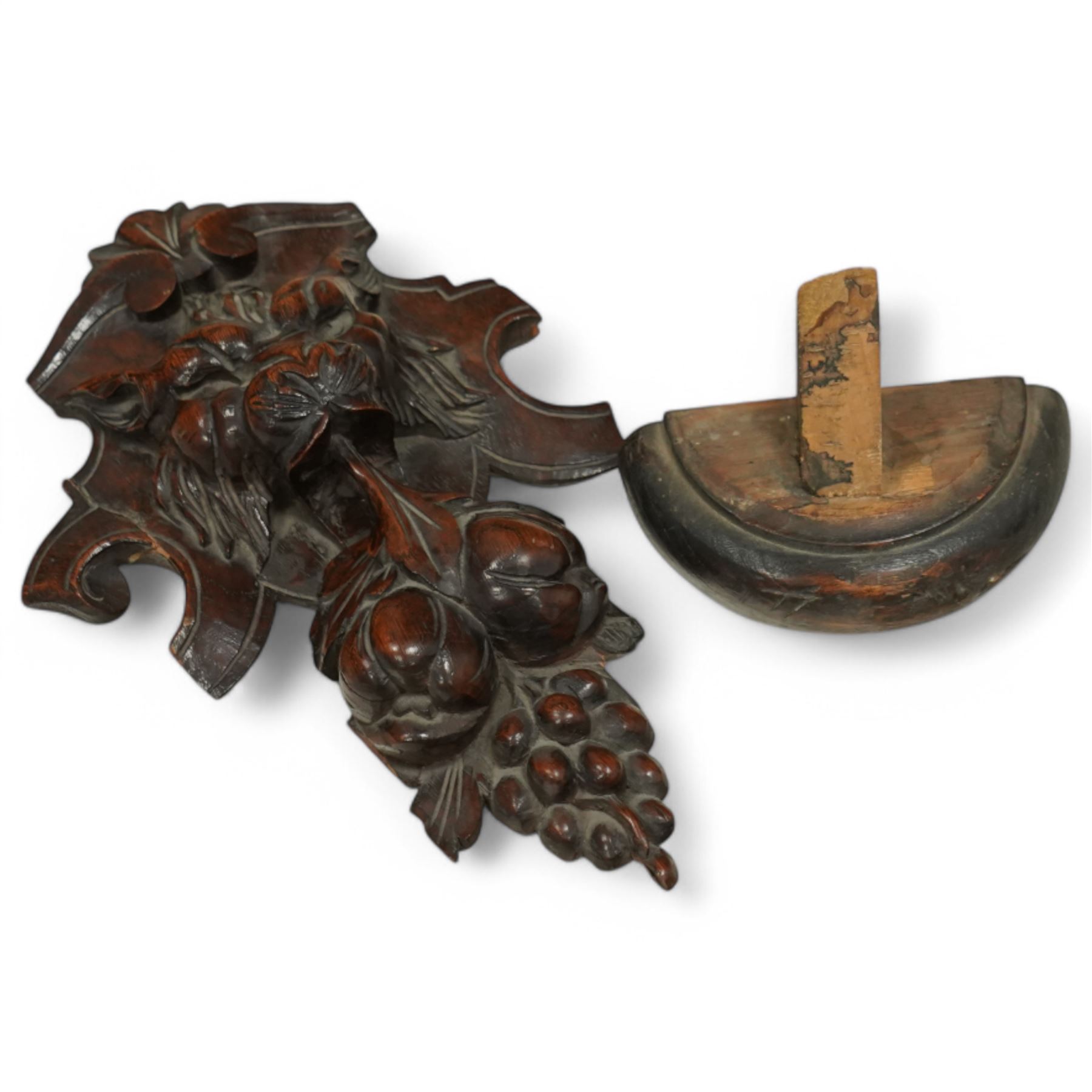 19th-century heavily carved oak baroque style cupboard with vine and floral carved frieze drawer above panelled cupboard door with floral carved appliqué (detached) flanked by symmetrically carved scroll and vine decorated sides, on bun feet 