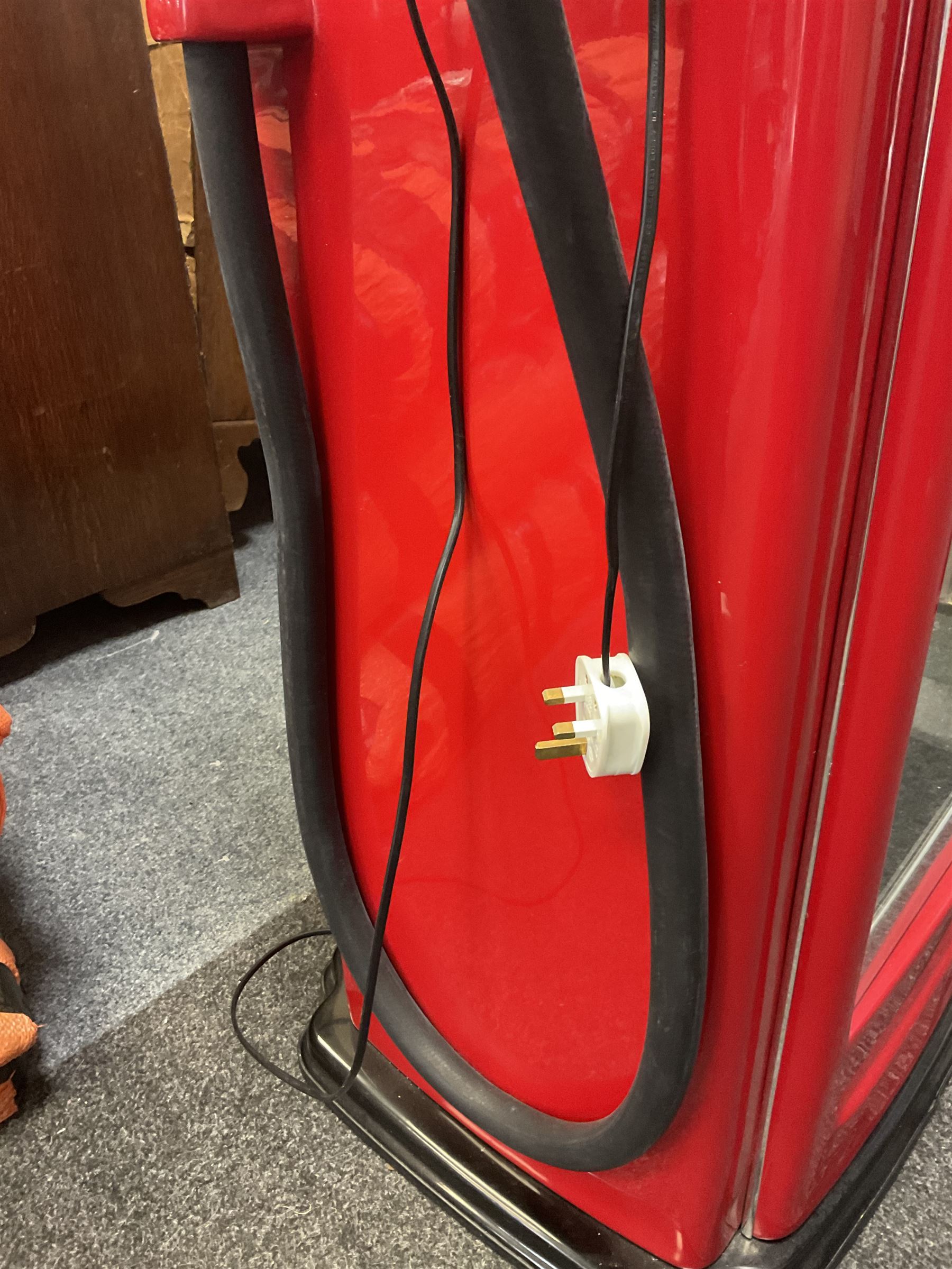 Roadside Relics Fender Custom Shop guitar display case, modelled as an American petrol pump, with a circular two-tone Fender logo light upon the pillar box red cabinet, three sides with glazed panels and chrome detailing, one etched with Fender logo, the interior with removable guitar stand, height including light 184cm