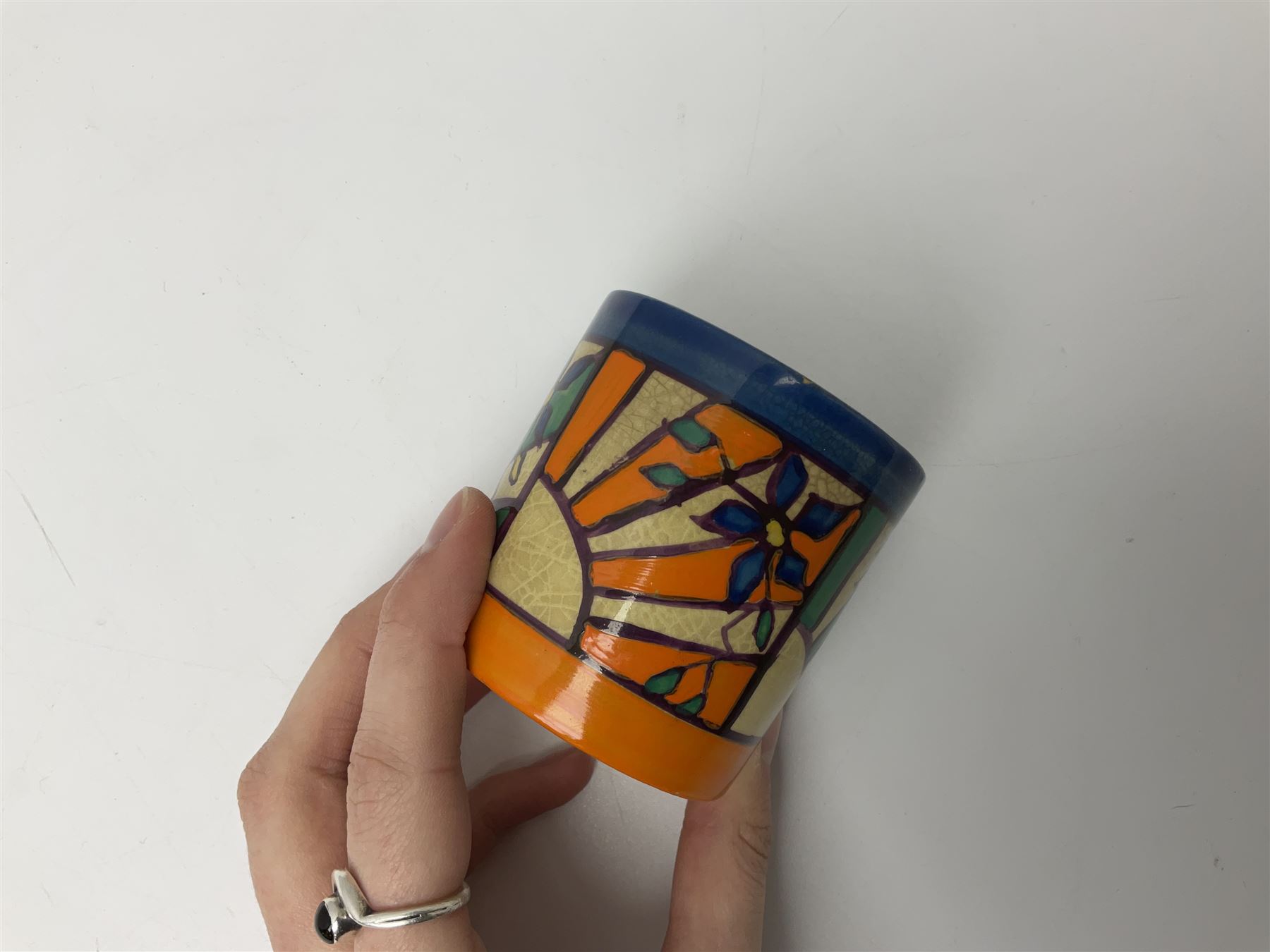 Clarice Cliff Fantasque for Wilkinson Pottery preserve pot, circa 1928, of drum form decorated in Sunray Leaves pattern, H8cm