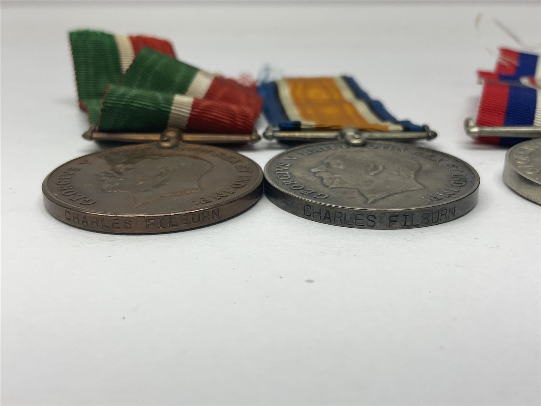 WW1 pair of medals comprising British war medal and Victory Medal awarded to 19774 Pte. G. Headlam Sea. Highrs.; another WW1 pair of medals comprising British War Medal and Mercantile Marine Medal awarded to Charles Filburn; WW2 group of five medals comprising 1939-45 War Medal, Defence Medal, 1939-45 Star, Africa Star and Burma Star; in issue box addressed to Mr. H, Smithson with medal slip; all with ribbons; and Edward VIII Coronation medal (10)