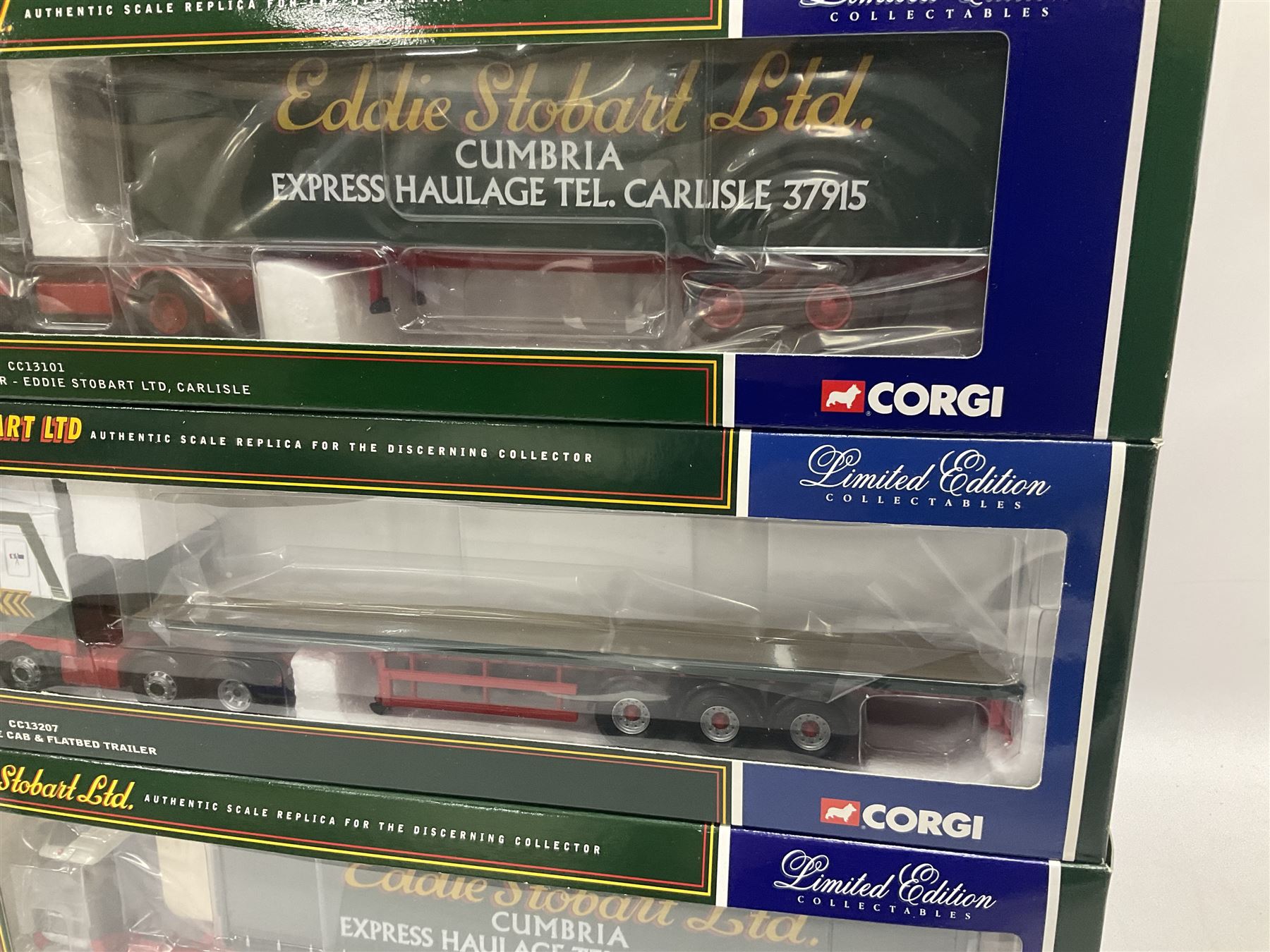 Corgi - four limited edition 1:50 scale Eddie Stobart heavy haulage vehicles comprising CC12802 Scania T-Cab Bulk Tipper; CC13207 DAF XF Space Cab and Flatbed Trailer; CC13101 Volvo F88 Box Trailer; and CC12607 Scammell Crusader Tautliner; all boxed (4)