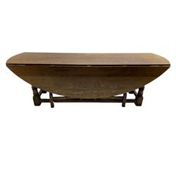 Large 18th century design oak wake or dining table, oval drop-leaf top, turned supports with double gate-leg action base, united by moulded stretchers 