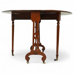 John Taylor & Son, Edinburgh - Late Victorian Aesthetic style walnut Sutherland table, with a hinged oval top on fret carved support, stamped John Taylor & Son Edinburgh, supported by scrolled feet on ceramic castor (Extended 105cm)