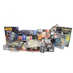 Star Wars puzzles and games, including four sealed MB Games 200piece jigsaw puzzles, two Darth Vader sculpture puzzles, limited edition sealed Ravensburger The Force Awakens Labyrinth game, two Special Edition Star Wars Trilogy Mousemats in original packaging, and a collection of Star Wars The Force Awakens ephemera including tins, flags, 3D glasses, etc