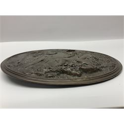 Late 19th century bronze plaque, of circular form, depicting the angel appearing to Adam and Eve in the garden of Eden in high relief, D25.5cm
