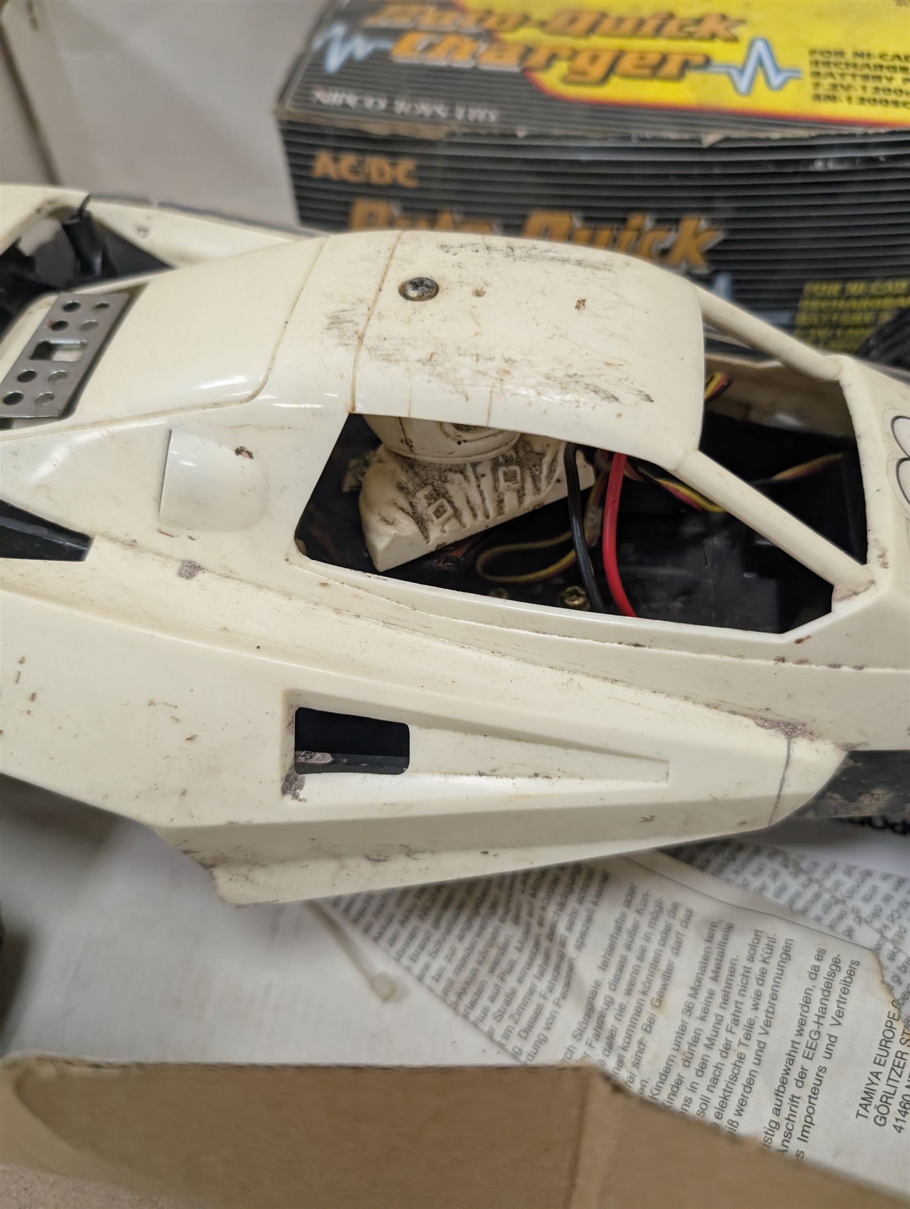 Tamiya 'The Grasshopper' 1:10 scale remote control car, boxed, together with an Acombs Techniplus-a controller, both boxed