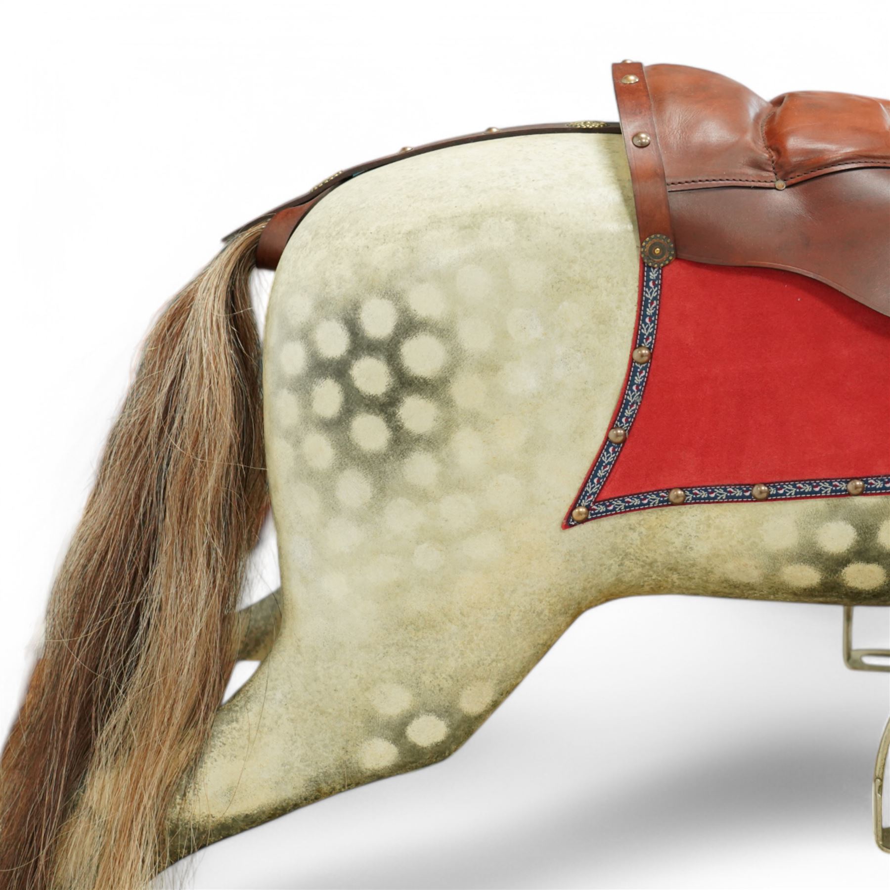 Frederick Henry Ayres (F H Ayres, London) - Late Victorian large carved wooden rocking horse, in dapple grey paint finish, decorated with glass eyes, leather reins, stirrup and saddle, indented hooves, on rockers united by chamfered stretchers and boarded base, c.1890