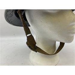 WW2 Home Front 'Police' black painted steel helmet with original liner and webbing chin strap, impressed R.O. Co. 1/1939; and re-painted shell only for WW2 Wardens steel helmet impressed AMC II 1941 C676 (2)