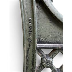 Neoclassical design cast iron and oak slatted garden bench, the twin end supports in the form of a Sphinx with acanthus carved knees and large paw feet, the pierced lattice bracket with Yorkshire rose motifs