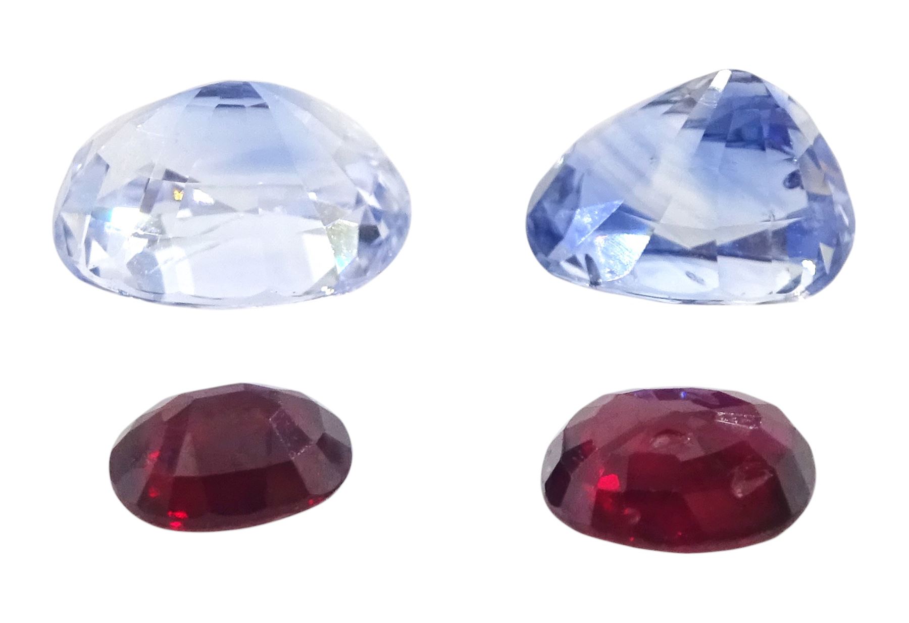 Two loose sapphires and two loose rubies, each ruby 0.58 carat and 0.82 carat