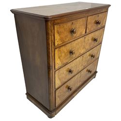 Early 20th century figured walnut chest, fitted with two short over three long drawers with bookmatch veneer facias, each with turned walnut handles, skirted base over compressed bun feet 