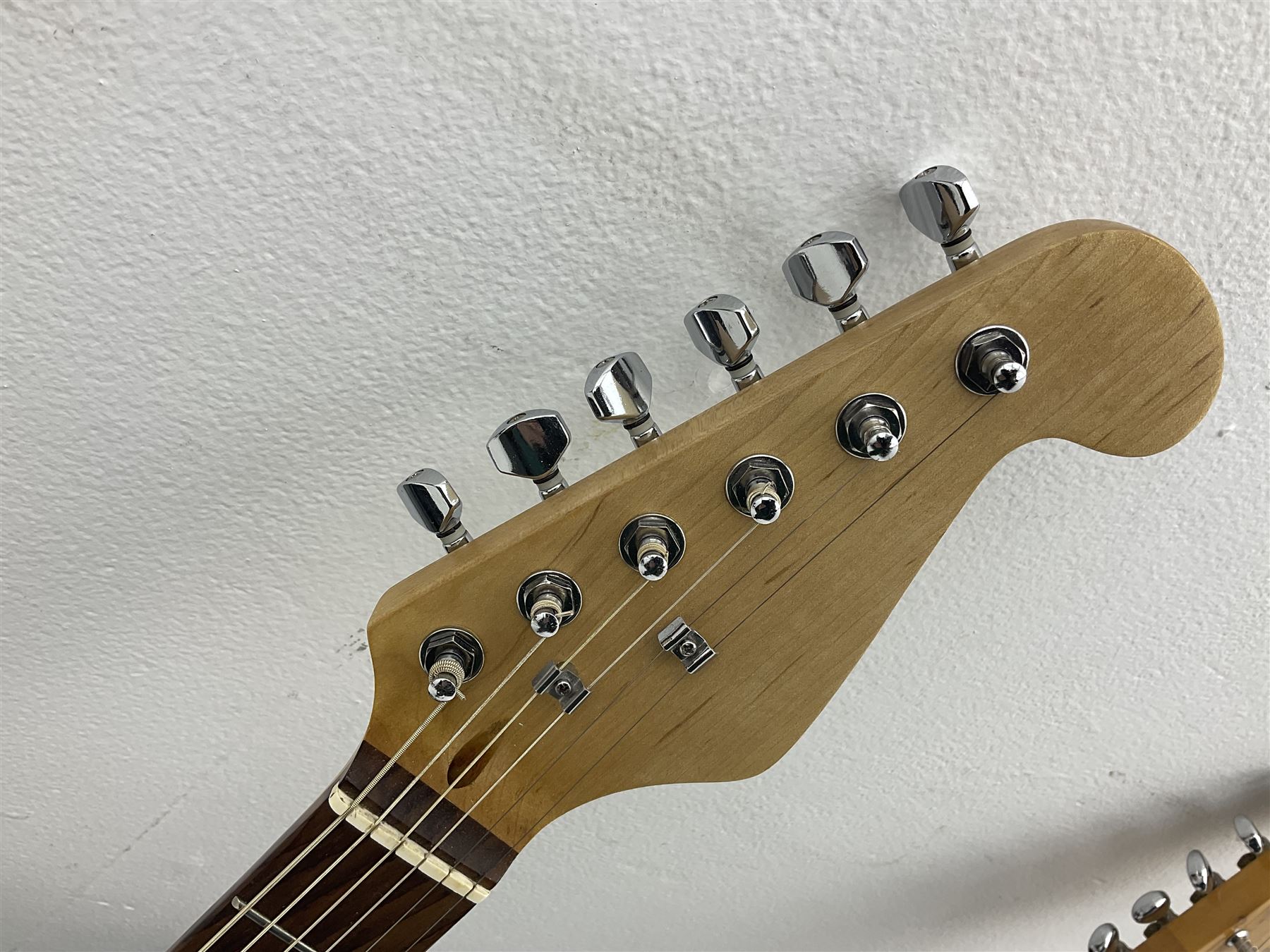 Fender style sunburst electric guitar with manuscript mark 'Zenta Stratocaster 1963' L97cm; in hard carrying case; another similar unmarked sunburst electric guitar; in gig bag; and Fender Frontman Amplifier, serial no.M473406 (3)