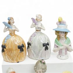 Collection of early 20th century ceramic half dolls, approximately 26, together with two novelty flasks in the form of ladies in evening dresses