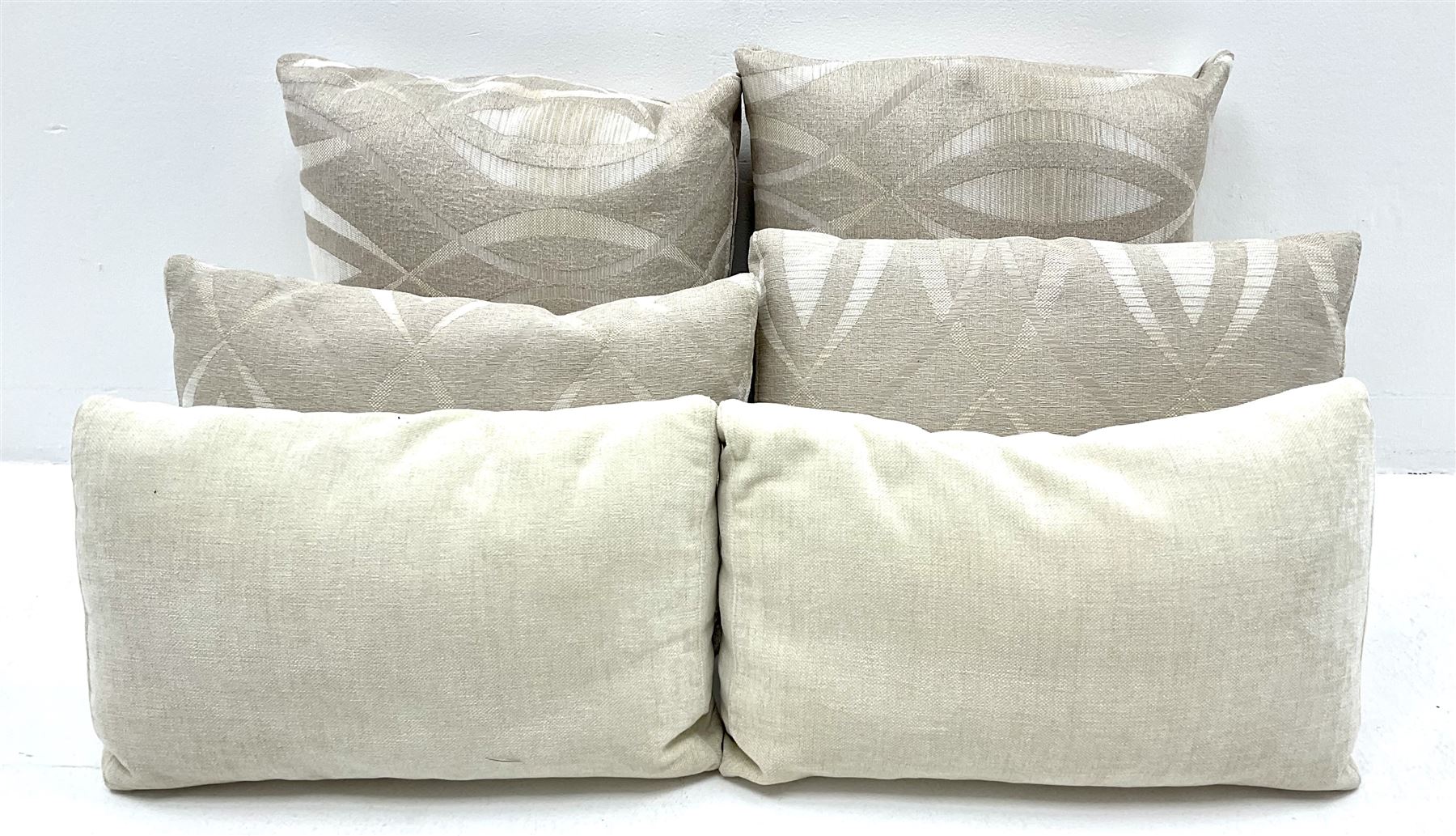 Grande four seat sofa upholstered in patterned fabric with contrasting scatter cushions 