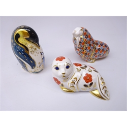  Three Royal Crown Derby paperweights: Penguin and Chick dated 1998, gold stopper, Walrus dated 1987, gold stopper and Seal dated 1986, silver stopper (3)  