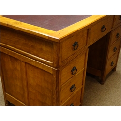  'Acornman' oak twin pedestal desk, adzed panelled sides and drawer fronts, leather inset top, seven drawers, panelled sides, by Alan Grainger of Brandsby, W126cm, H81cm, D64cm  