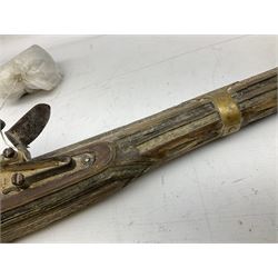 Two North African flintlock guns for restoration or wall display comprising blunderbuss with Moorish style full inlaid hardwood stock L102cm; and musket, the Moorish style full inlaid hardwood stock with five brass barrel bands L113cm (2)