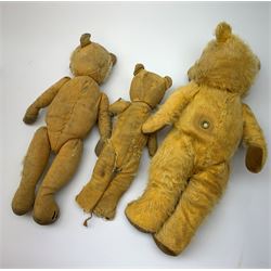 Five English teddy bears c1930s-50s including wood wool filled Chiltern bear with swivel jointed head, glass eyes, plastic dog type nose, inoperative musical movement and jointed limbs with velvet pads H16.5