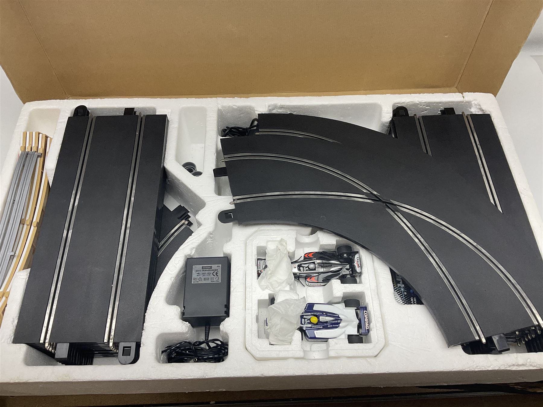 Scalextric - Formula One set with McLaren Mercedes and Williams BMW cars; and Speed Extreme set with Ford Focus cars; both boxed with accessories and paperwork; and Parker Pro-Action football game; boxed (3)