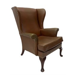 Parker Knoll - mid-20th century wing back armchair, upholstered in Rexine type cover