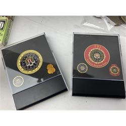 Sixty-nine American challenge coins of military and security force interest including FBI, OSI, IRS, Customs, Iraq War etc, two in easel display cases; together with two unopened packs of playing cards for Iraqi Most Wanted and Radacad