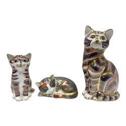 Three Royal Crown Derby cat paperweights, comprising Catnip Kitten together with two Imari examples modelled seated, two with gold stoppers, tallest H13cm