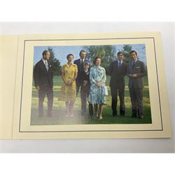 H.M. Queen Elizabeth II and H.R.H. The Duke of Edinburgh, signed 1976 Christmas card with twin gilt Royal cyphers to cover, colour photographic print of the Royal Family to interior, and signatures Elizabeth R and Philip with the manuscript date 1976 below